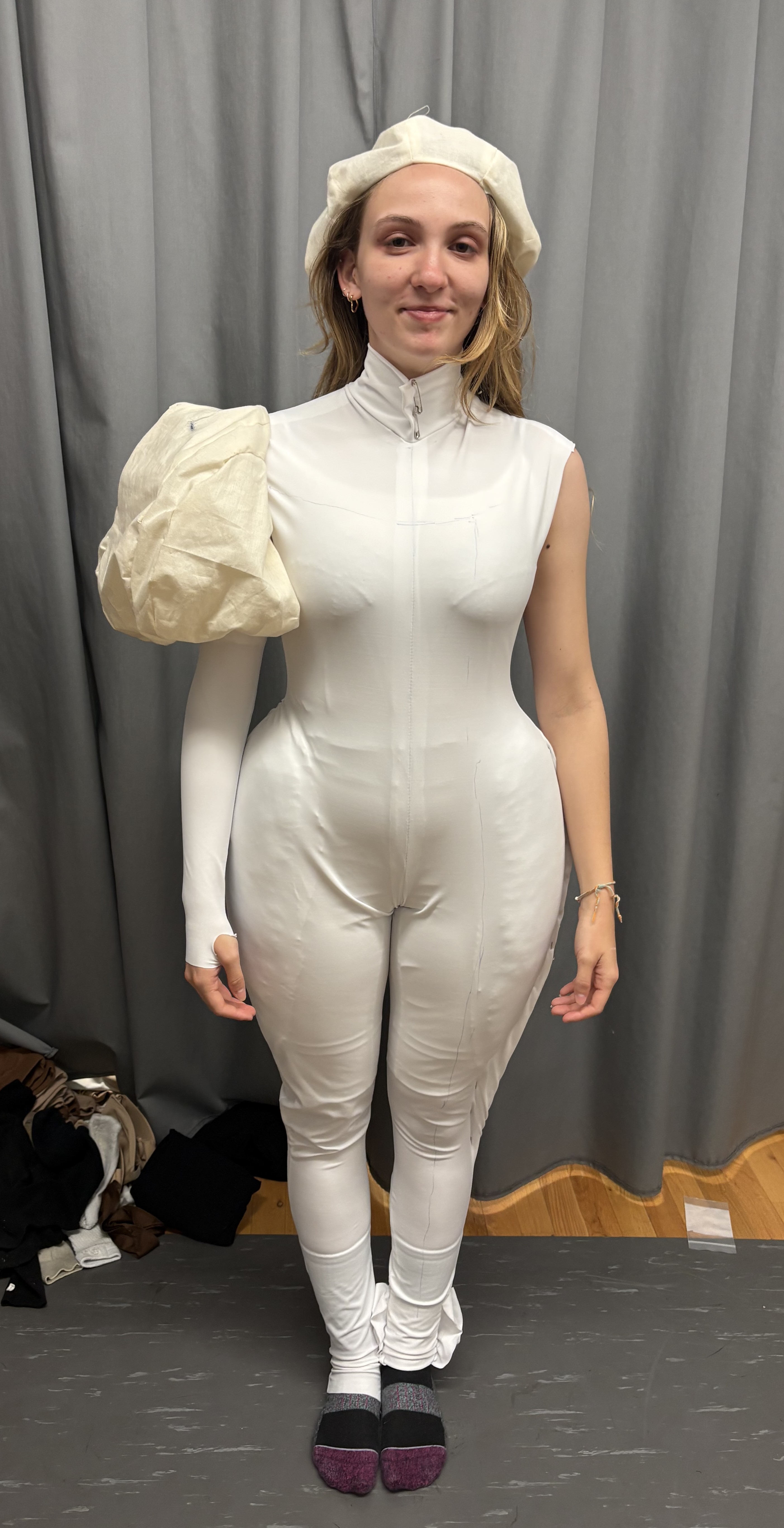 A woman in a white unitard