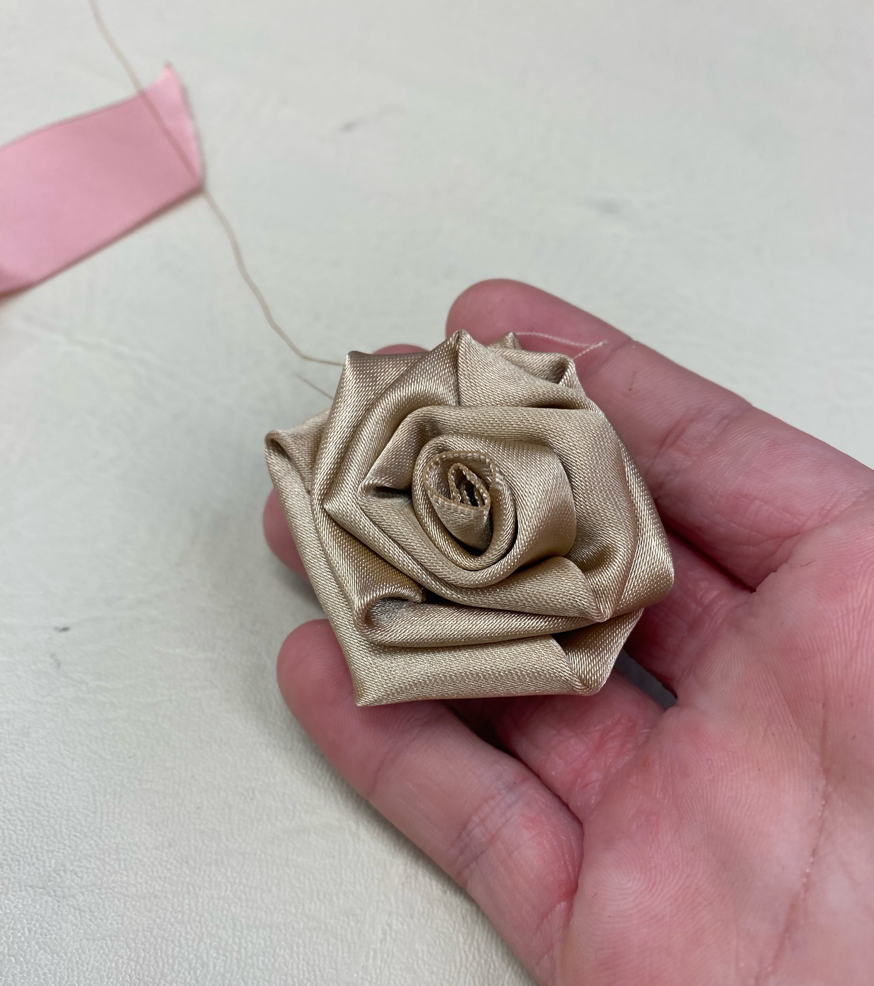 a gold ribbon rose