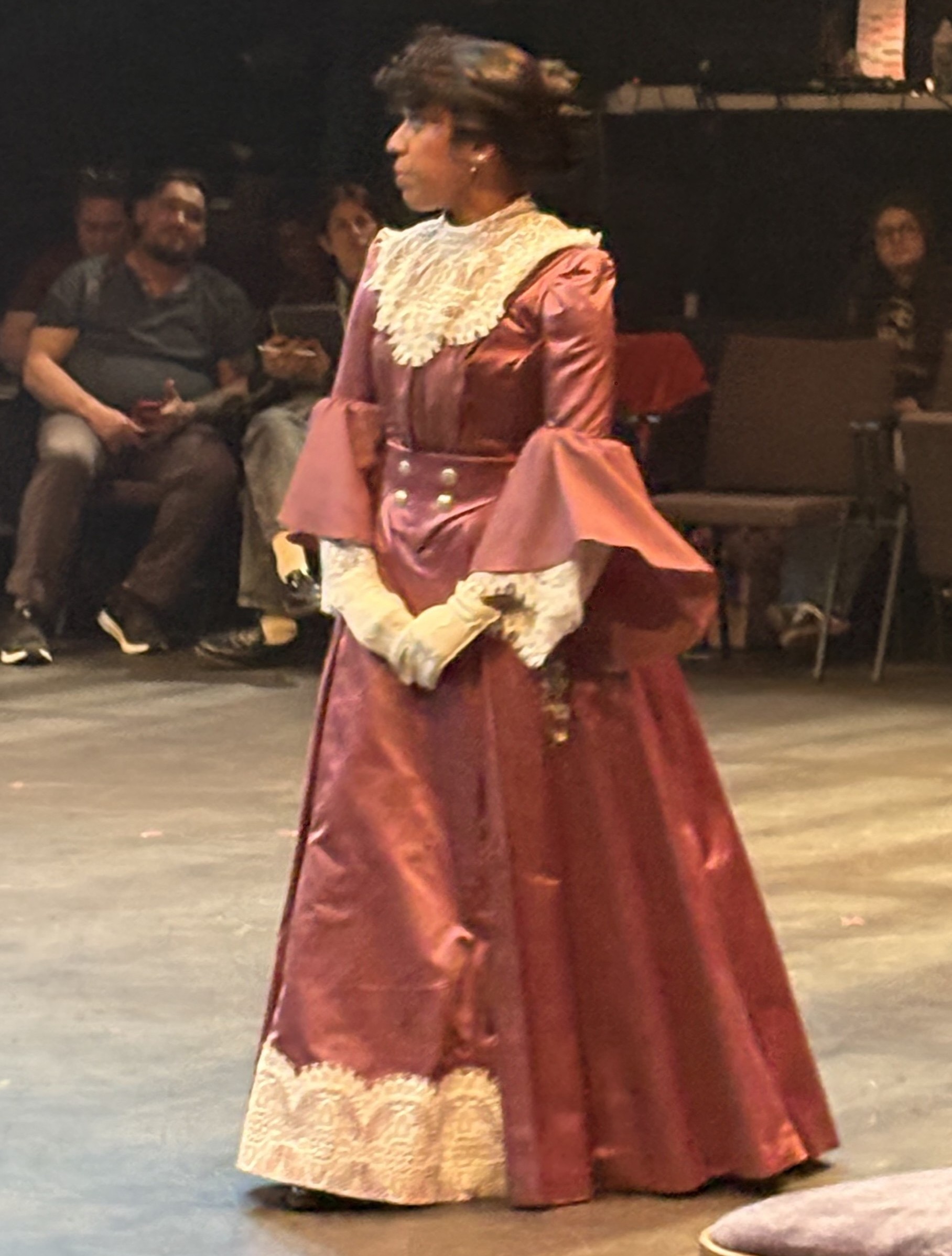 A purple edwardian dress with a lace collar