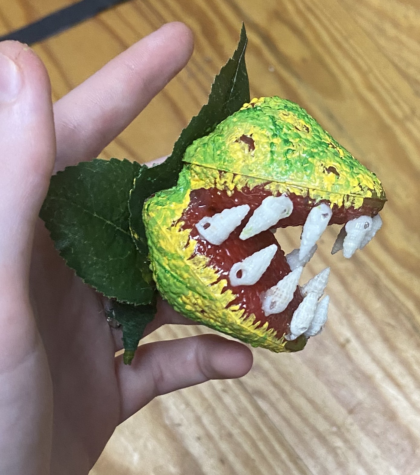 a green carnivorous plant boutonniere