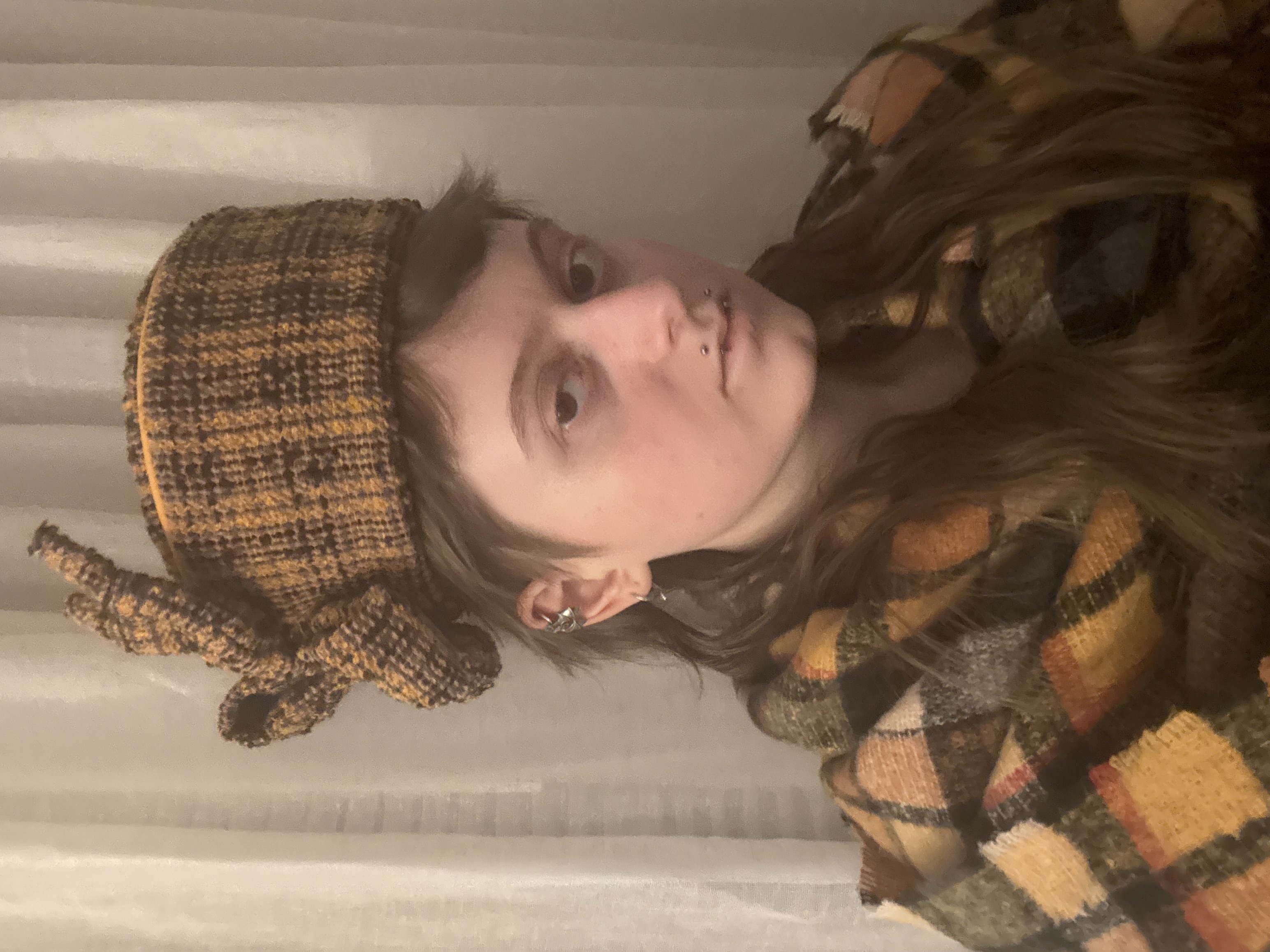 Orange plaid pillbox hat, side view